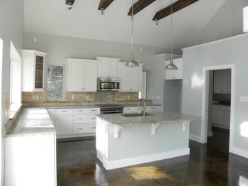 Kitchens have energy-miser appliances, such as an induction cooktop.