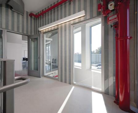 At the penthouse level, a landing offers access to the training room (which doubles as a dining room and boasts a kitchen) and an outdoor terrace beyond.