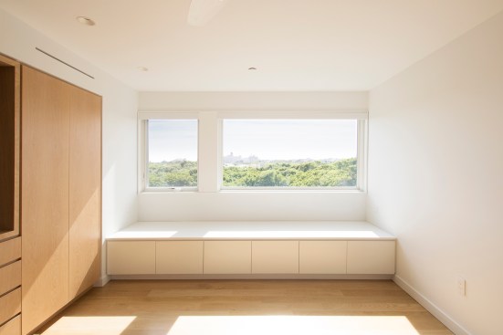 A built-in window bench in the bedroom provides added storage