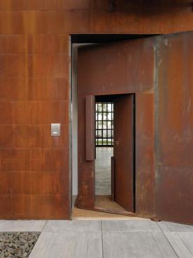 The upper handle operates an oversize pivoting door.