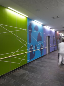 A+foursome+of+artists+-+Michael+J%c3%a4ger%2c+J%c3%bcrgen+Palmtag%2c+Volker+Saul+und+David+Harley+-+worked+with+interior+designers+to+develop+the+concept+and+placement+of+the+expansive+mural.+The+mural+consists+of+a+series+of+abstract+scenes%2c+cartoon+strips%2c+and+bold+color+applications.