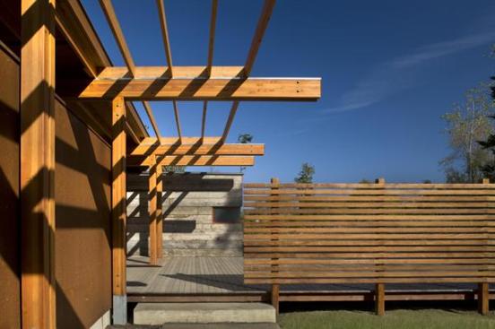 A series of wood screens guide visitors to the main entry.