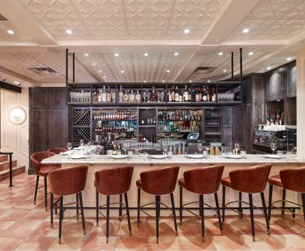 Decorative ceiling panels over this bar, the main dining area, the antipasto bar and beyond, help to unify the space. 