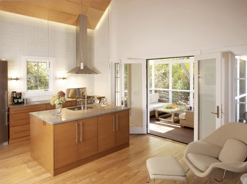 Kitchen area that opens to a screened porch
