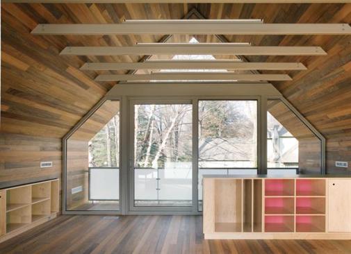 Built-ins in the playroom form an edge to the stairwell.
