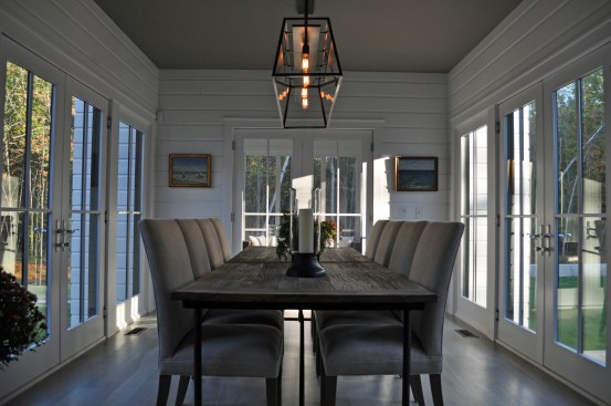 Dining Room encased in windows and doors leading to the outside
