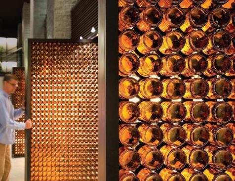 Blatz Bottle Apertures - Milwaukee, Wisconsin As part of a conversion of Milwaukee’s Blatz Brewery, one of the country’s oldest and now defunct breweries, into a mixed-use project, Johnsen Schmaling Architects designed bottle doors—pivoting apertures that separate the two-story entry lobby from an adjacent public lounge area.
Architect: Johnsen Schmaling Architects