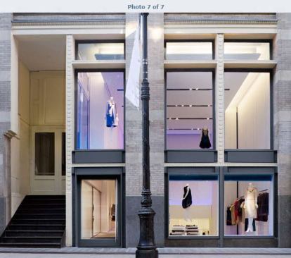 Vera Wang Boutique - Soho, NY Customers enter as performers on a stage, stepping into the elevated, double-height proscenium at the front of the store. The spatial sequence unfolds down a full-width, white Corian grand stair, which transitions into the more intimate display and changing area at the rear of the space. 
Architect: Gabellini Sheppard Associates