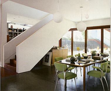 The dining room and kitchen overlook the courtyard. Folding ipe doors bring in lots of light.