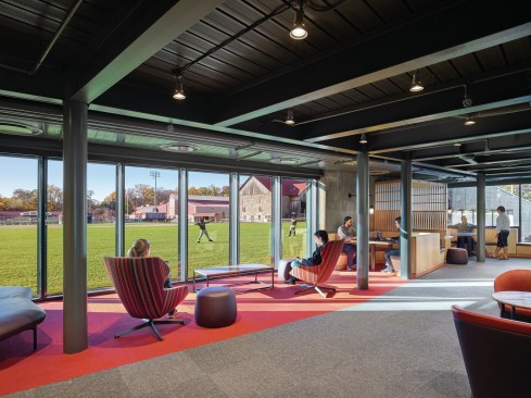 The new building doubles the student population housed in the three adjacent dorms. To preserve the intimate scale of the existing context, the new dorm is broken into three separate massings--each similar in scale to its nearest adjacent dorm. The space between the new and old buildings creates an outdoor commons that becomes the center of this 240 student residential community.