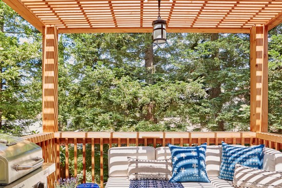The new redwood deck is just off the remodeled kitchen. Featuring a new grill and beautifully appointed furniture, the family utilizes the space daily.