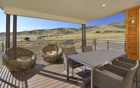 The covered back porch provides wide-open views of the surrounding countryside.