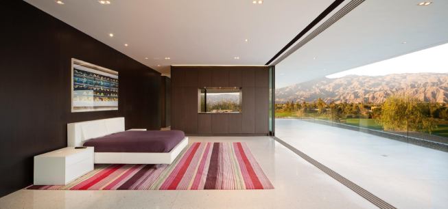 The master bedroom’s second-floor perch affords dramatic mountain views.