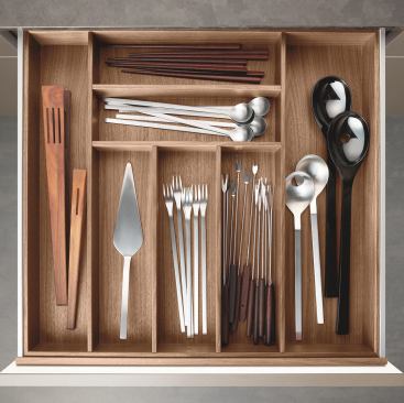 Poggenpohl’s drawer insert and pull-out system is now available in a walnut finish. The aluminum pull-outs have 8-millimeter sides and activate indirect LED cabinet lighting when opened. The drawers come as a box system or with aluminum, walnut, or maple crossbars. Poggenpohl, www.poggenpohl.com; 49.5221.381.0.