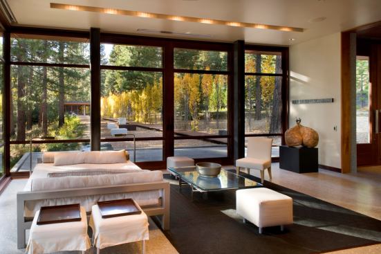 The guest house faces the archives pavilion across a boardwalk and a Swedish aspen allee.