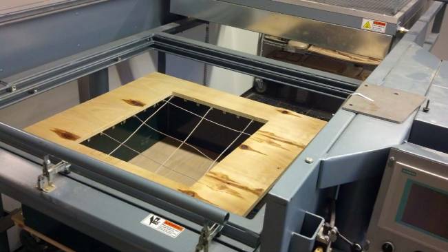 A crude varied mold made of cable wire and plywood (above) generates a complex pillow-like sheet of formed material (bottom).