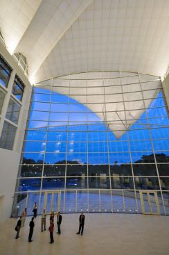 Carefully aimed in-grade ceramic metal halide adjustable accents illuminate the pronounced form of the exterior roof overhang.