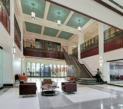 The lobby has collaboration spaces and views into the clean room.
