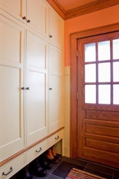 Craftsman cabinetry with space for shoes below creates a crisp entryway that maintains the warmth of this 1900s home’s original design. Project: Private Residence, Minneapolis; Architect: Rehkamp Larson Architects, Minneapolis; Builder: Full Circle Construction, Minneapolis