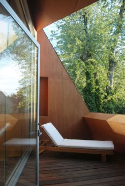 A small terrace on the third floor can't be seen from the street and is sheltered by a large oak tree. "It's very hidden," Sokoal says, "and people are often surprised when they discover it."