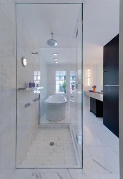 A clear glass enclosure allows both the tub and shower to enjoy natural lighting, and opens up a space that might otherwise feel cramped. Project: 308 Mulberry, Lewes, Del.; Builder: Ilex Construction, Easton, Md.; Architect: Robert M. Gurney, Washington, D.C.