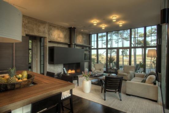 The kitchen flows into the living room, which supplies a low-key but elegant backdrop for serene wetlands vistas.