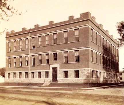 An elevation from his original drawings as well as an archival photograph circa 1891 show the masonry walls, taller second and third stories (to provide more light for large lab rooms), and chimneys, which appear at first glance to be crenellations. The Nassau Street entrance (shown) was the building's main entry until the addition was completed.