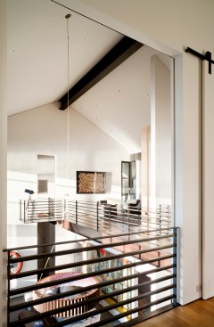 View+to+double-height+living+space+from+master+bedroom.