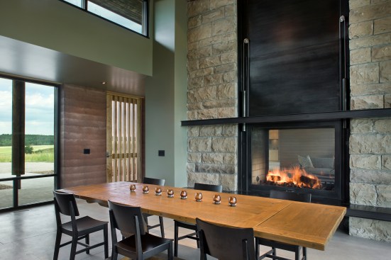 Interior, horizontal, dining room toward fireplace and front entry, Earth Wall II, Squirrel, Idaho; Ward + Blake Architects