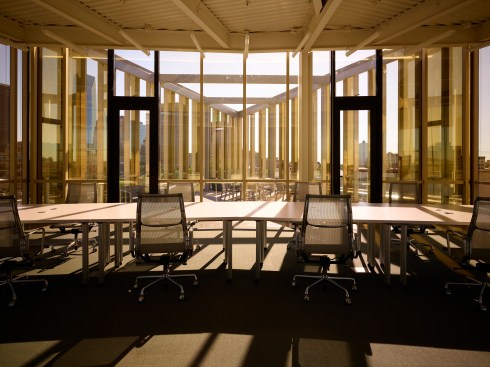The 3rd floor multi-purpose room becomes an artistic volume with the late afternoon sun.  The awning windows pushed open reflect the rooftop river rocks.  
