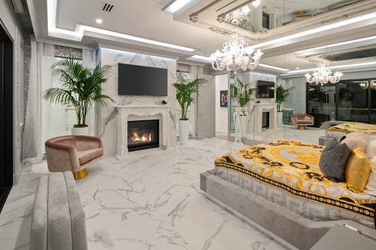 Mirrors on the wall and ceiling in the primary bedroom.