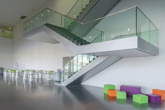 The same bright colors from the stacks are carried through to the accent furniture.