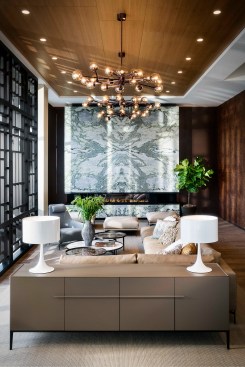 Meriel North’s first floor includes a living room with a floor-to-ceiling fireplace set within a towering wall of green onyx from Turkey, with a pattern and colors that evoke sea foam, bringing a sense of serenity and freshness to the space.