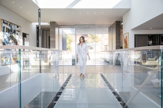 Beverly Hills modern luxury home glass bridge walkway under custom skylight.  