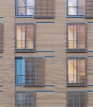Cypress cladding and movable louvers.