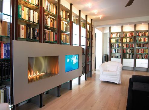 A flat-screen TV and vent-free gas fireplace are suspended from two aluminum boxes that hang from steel tubes. The 1/2-inch-thick aluminum-wrapped honeycomb panel face lifts off for access.