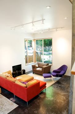 The living room is small but light-filled and bright.