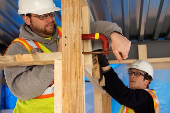 Students at work on Harvest House.