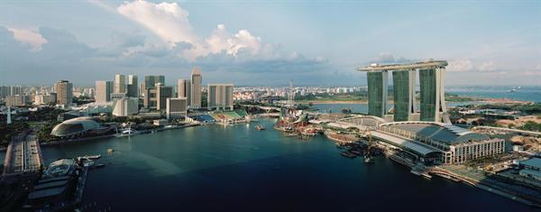 The Marina Bay Sands complex brings a taste of Las Vegas to Singapore. Three 55-story hotel towers are topped by a skypark that culminates in a 213-foot-long cantilever?the signature move in a 38-acre complex that also includes a casino, a retail complex, performance venues, a convention center, and a museum.