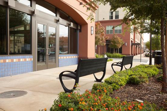 Trio Benches shown in 6 foot, backed configuration with Black Texture powdercoated frame, extruded aluminum slats and two armrests at BART, Pleasant Hill/Contra Costa Centre Station, Walnut Creek, California