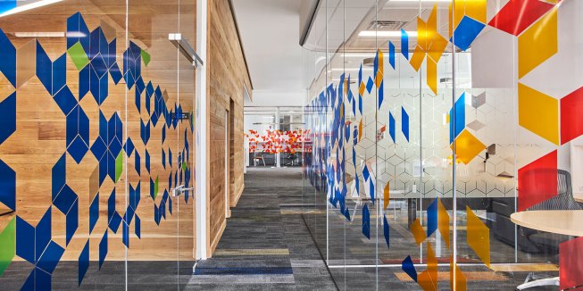 Detail photo of interior super graphics along conference room glass. 