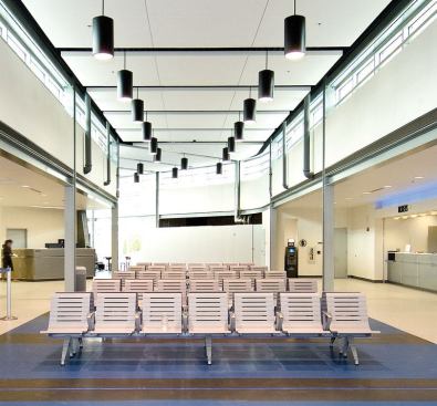 The clerestory-lit ticketing hall is a simple but resilient interior with durable Nora rubber floor tiles that will withstand high traffic. Combining Greyhound, Amtrak, and MetroLink into one complex streamlines transit operations for downtown St. Louis, but will mean intense wear and tear on the building itself.