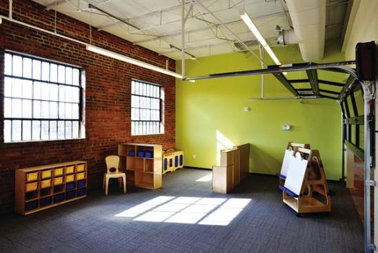 Spanish Education Development Center Rolling garage doors separate the center?s preschool classrooms (pictured) from the main play area. With all the doors opened, the combined space can be used to host events.