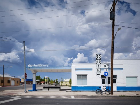 Northwest+corner+of+the+building+looking+east.++The+gasoline+filling+functions+under+the+canopy+have+been+replaced+with+a+custom+designed+concrete+table+and+%09benches.+This+corner+is+the+most+popular+seat+in+town.+