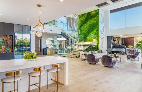 Double height open volume open plan modern Los Angeles home with bright interior design.