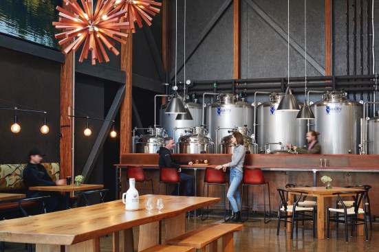 Inside the taproom. Custom millwork was fabricated from trees found on the farm.