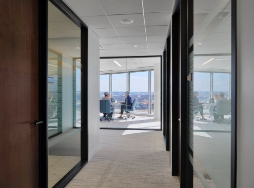 Transparent conference rooms and corridors frame views of the Ohio River.