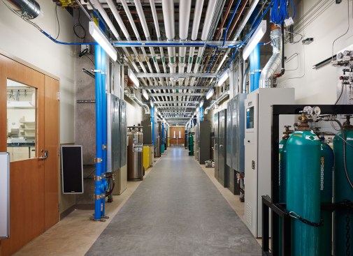 The 12-foot wide service corridor serves a critical support function by segregating heat-generating, noisy, dirty equipment from the sensitive research environment within the main laboratories. The lab module also includes a zone within the service corridor for storage, gas cylinders, and ventilated gas cabinets —there are 37 different specialty gases available. Oversized doorways into the labs facilitate moving and reconfiguring large equipment and delivering supplies.
