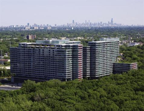 The towers are clad entirely with an aluminum and-glass curtain-wall system crafted by Chinese company PD Manufacturing International. The system has integral sunshades (like the two-tiered red aluminum panels on windows on some south and west fa?ades) to offset glare in a neighborhood where the only sources of shade for each tower are the other two towers in the complex.