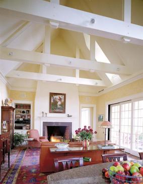Muse Architects sure-handed addition to this 1700s house includes a great room with an attached sunporch. Exposed ceiling beams maintain the buildings rustic character.